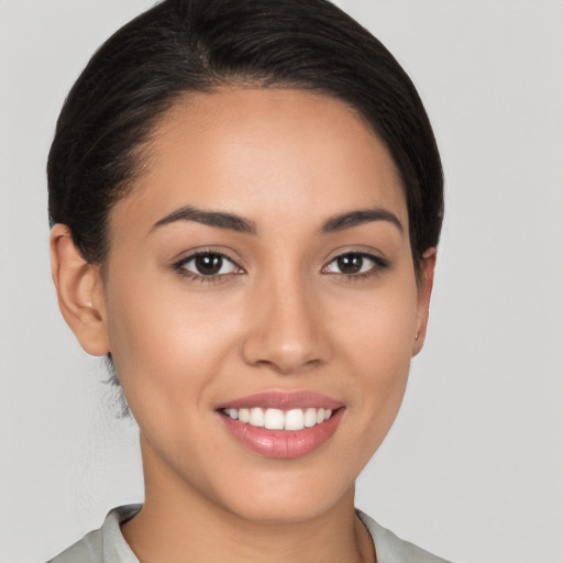 Joyful white young-adult female with medium  brown hair and brown eyes