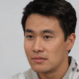 Neutral asian young-adult male with short  black hair and brown eyes