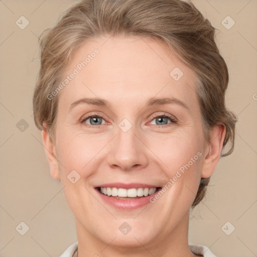 Joyful white adult female with medium  brown hair and green eyes