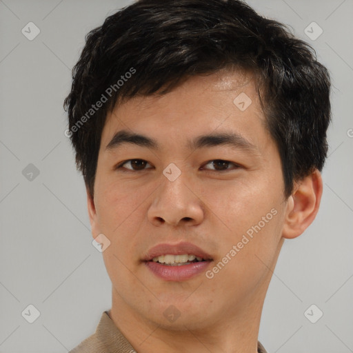 Joyful asian young-adult male with short  brown hair and brown eyes