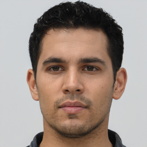 Neutral white young-adult male with short  black hair and brown eyes