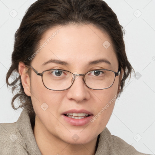 Joyful white adult female with medium  brown hair and grey eyes