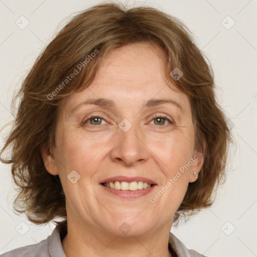 Joyful white adult female with medium  brown hair and green eyes