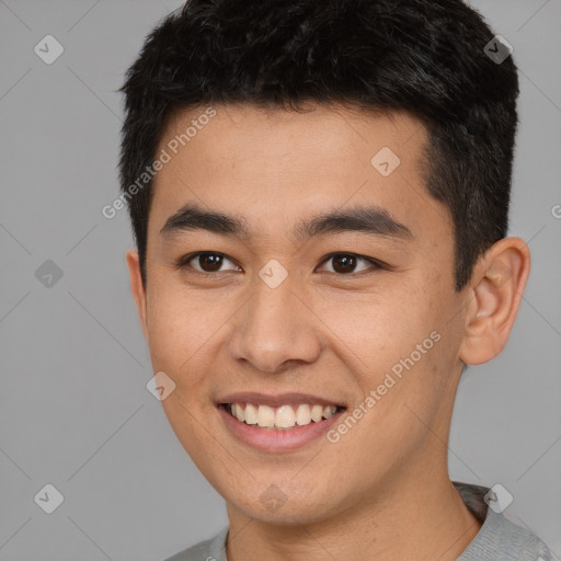 Joyful latino young-adult male with short  brown hair and brown eyes