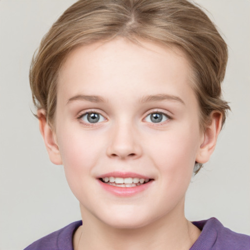 Joyful white child female with short  brown hair and grey eyes