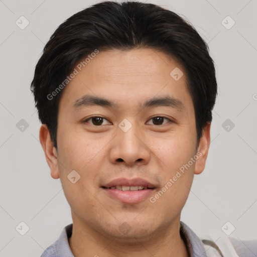 Joyful asian young-adult male with short  brown hair and brown eyes