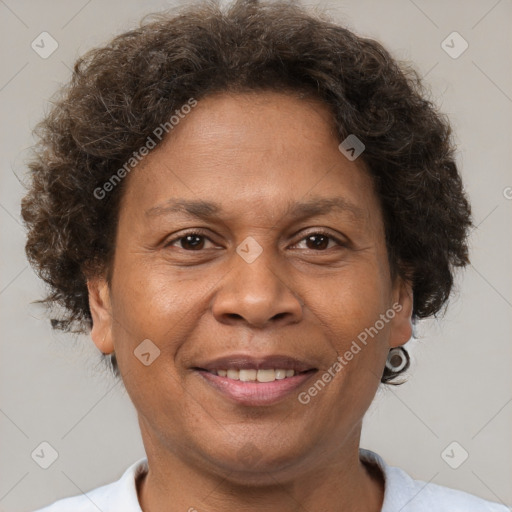 Joyful black adult female with short  brown hair and brown eyes