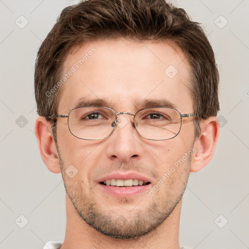 Joyful white adult male with short  brown hair and grey eyes