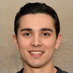 Joyful white young-adult male with short  black hair and brown eyes