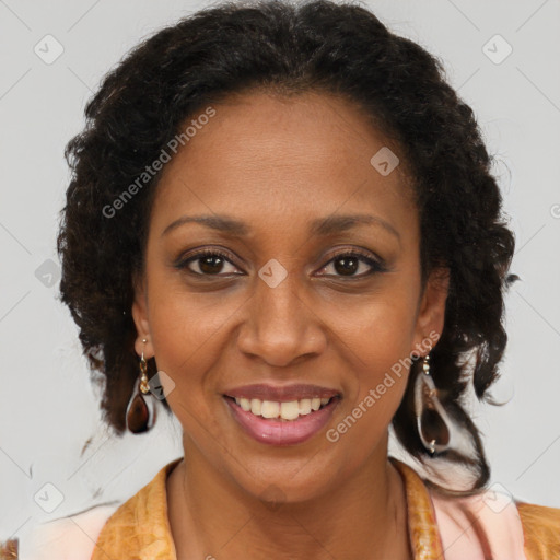 Joyful black adult female with medium  brown hair and brown eyes