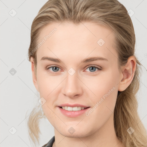 Joyful white young-adult female with long  brown hair and blue eyes