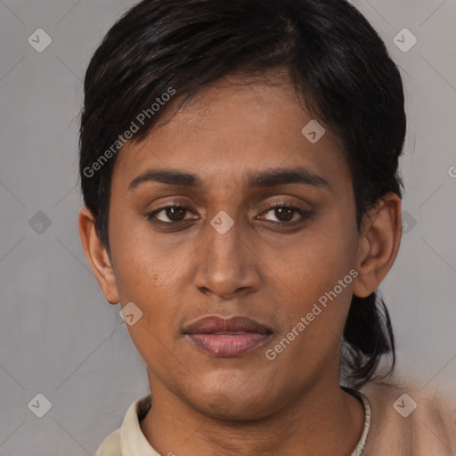 Joyful black young-adult female with short  brown hair and brown eyes