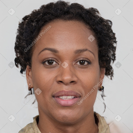 Joyful black adult female with medium  brown hair and brown eyes