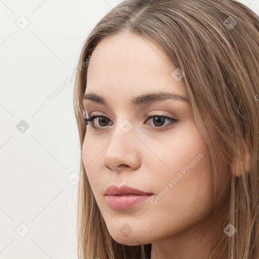 Neutral white young-adult female with long  brown hair and brown eyes