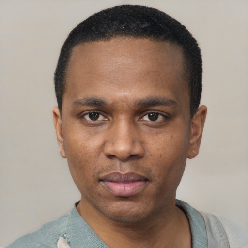 Neutral black young-adult male with short  black hair and brown eyes