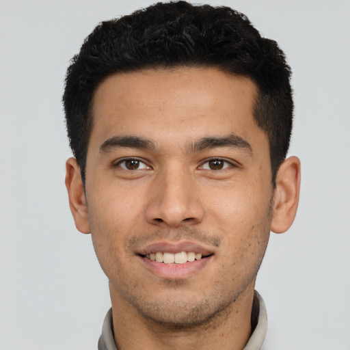 Joyful asian young-adult male with short  black hair and brown eyes