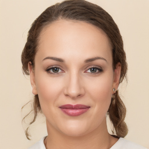 Joyful white young-adult female with medium  brown hair and brown eyes