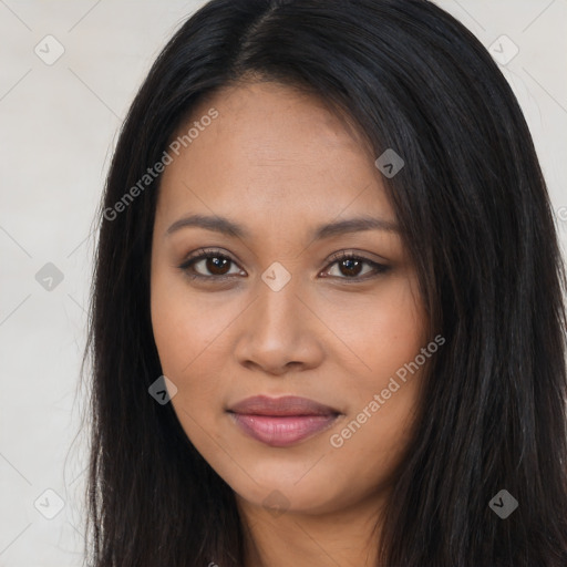 Joyful latino young-adult female with long  brown hair and brown eyes