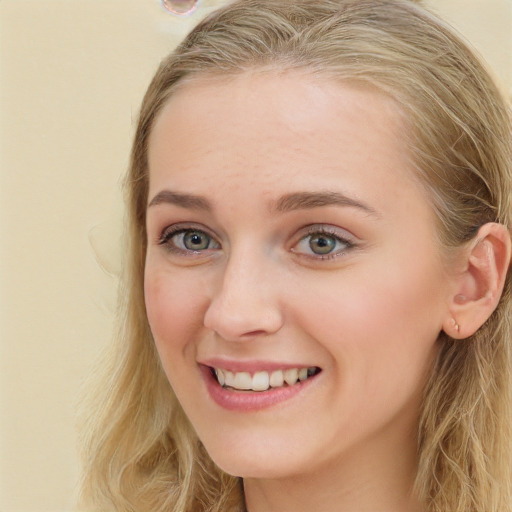 Joyful white young-adult female with long  brown hair and blue eyes