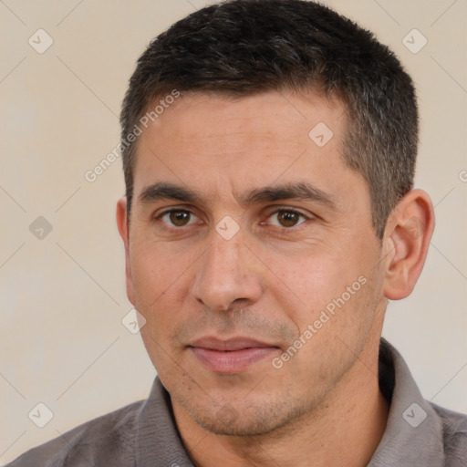 Joyful white adult male with short  brown hair and brown eyes