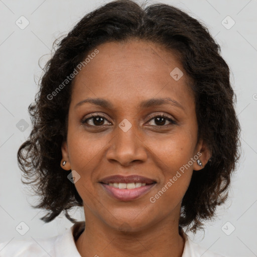 Joyful latino adult female with medium  brown hair and brown eyes