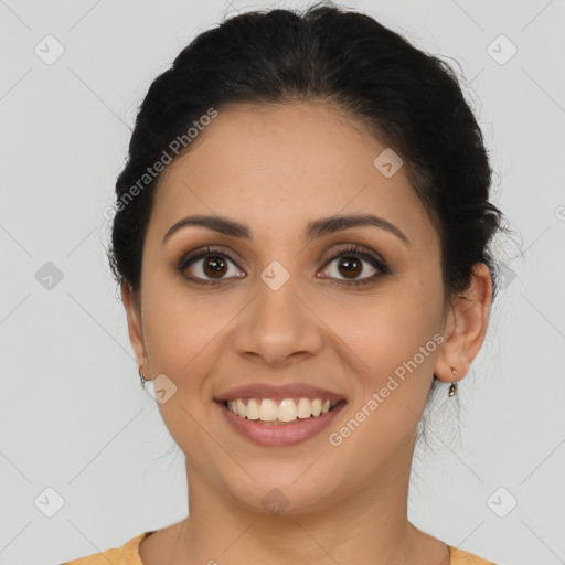 Joyful latino young-adult female with short  brown hair and brown eyes