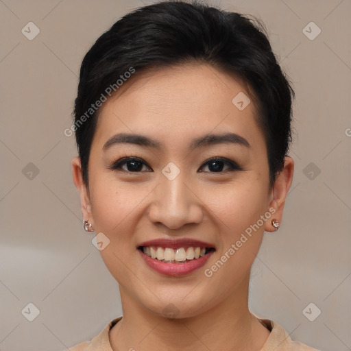 Joyful asian young-adult female with short  brown hair and brown eyes