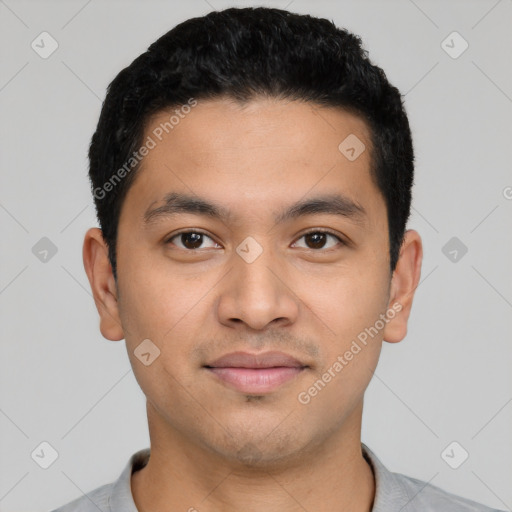 Joyful latino young-adult male with short  black hair and brown eyes