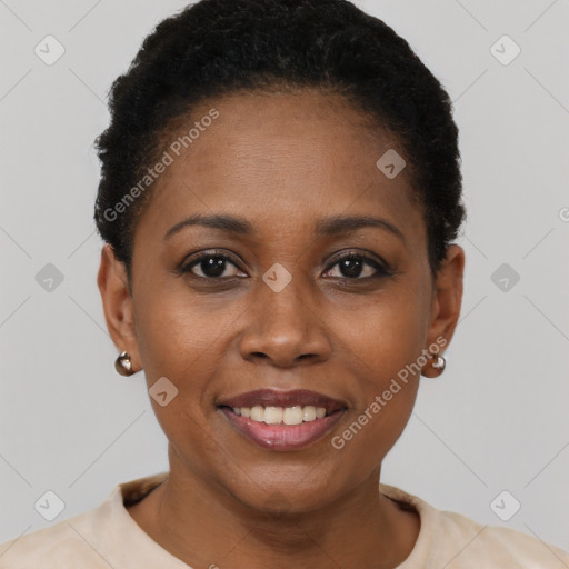 Joyful black young-adult female with short  black hair and brown eyes