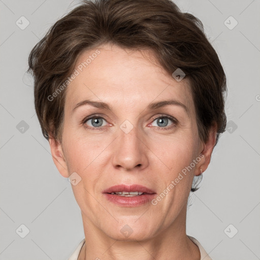 Joyful white adult female with short  brown hair and grey eyes