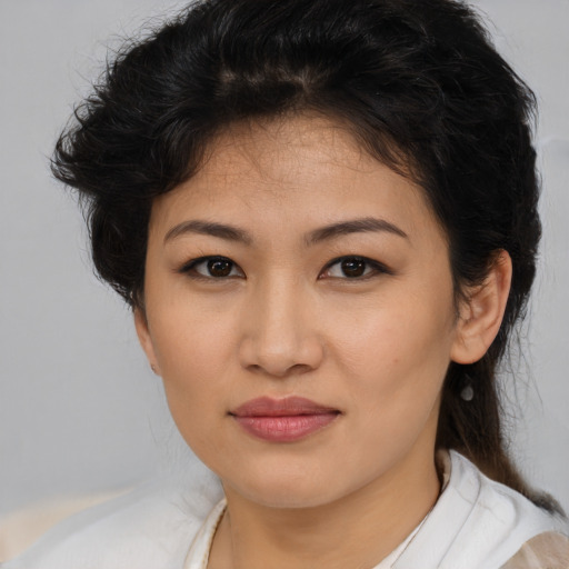 Joyful asian young-adult female with medium  brown hair and brown eyes