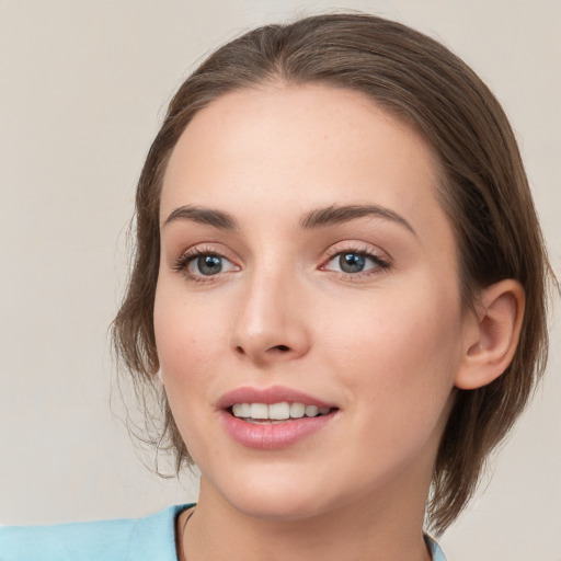 Joyful white young-adult female with medium  brown hair and green eyes