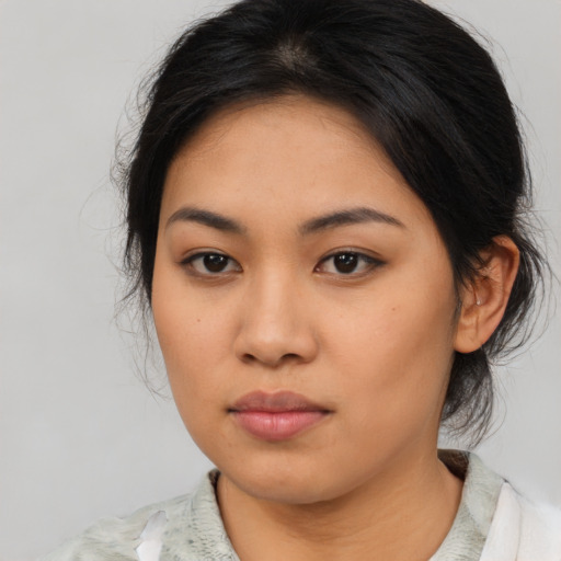 Neutral asian young-adult female with medium  brown hair and brown eyes