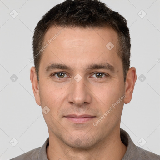 Joyful white young-adult male with short  brown hair and brown eyes