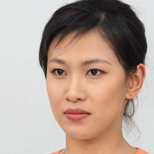 Neutral asian young-adult female with medium  brown hair and brown eyes