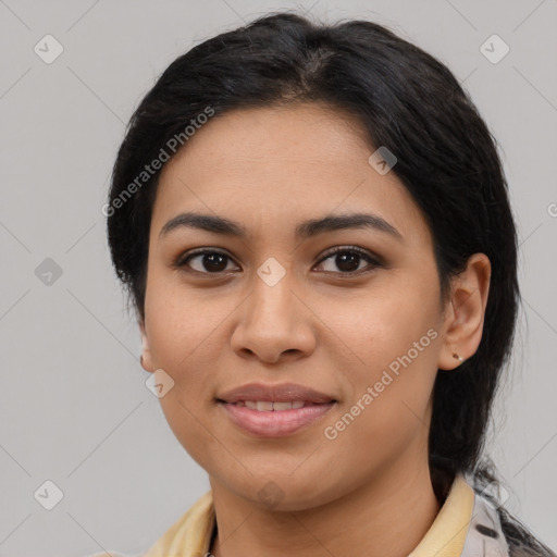 Joyful latino young-adult female with medium  black hair and brown eyes