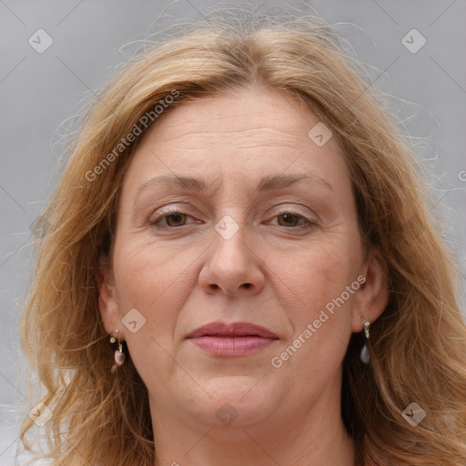 Joyful white adult female with medium  brown hair and blue eyes