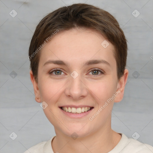 Joyful white young-adult female with short  brown hair and grey eyes