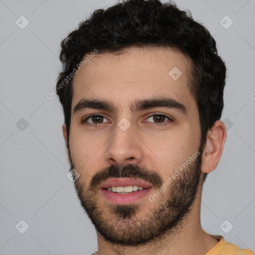 Joyful white young-adult male with short  black hair and brown eyes