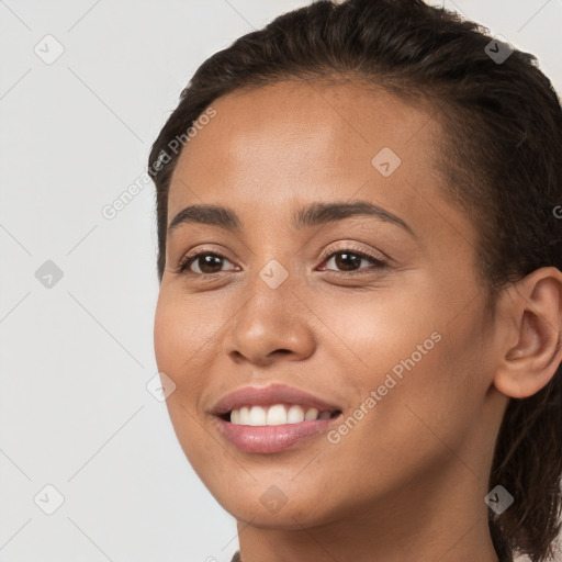 Joyful white young-adult female with long  brown hair and brown eyes