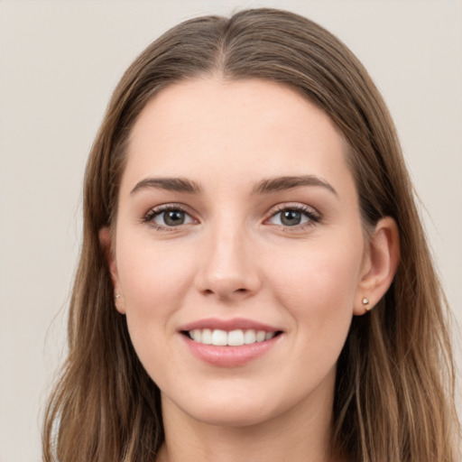 Joyful white young-adult female with long  brown hair and grey eyes