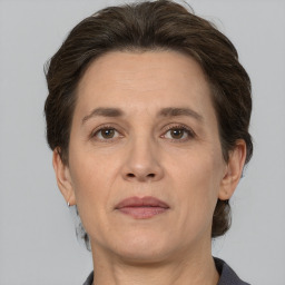 Joyful white adult female with short  brown hair and brown eyes