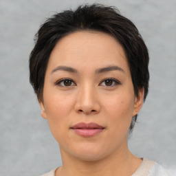 Joyful asian young-adult female with short  brown hair and brown eyes