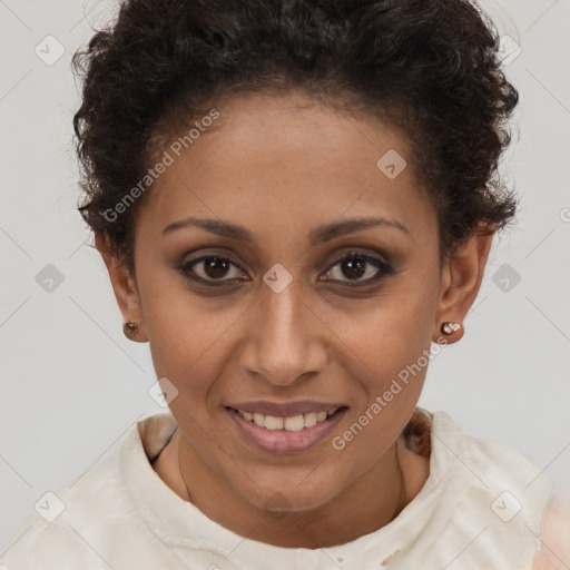 Joyful black young-adult female with short  brown hair and brown eyes