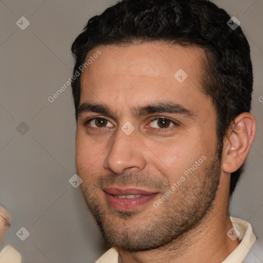 Joyful white adult male with short  brown hair and brown eyes