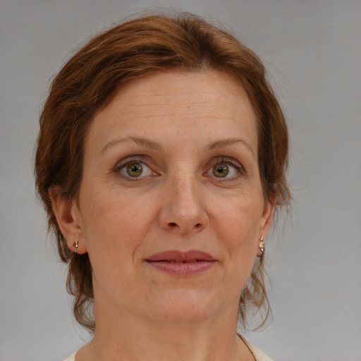 Joyful white adult female with medium  brown hair and blue eyes