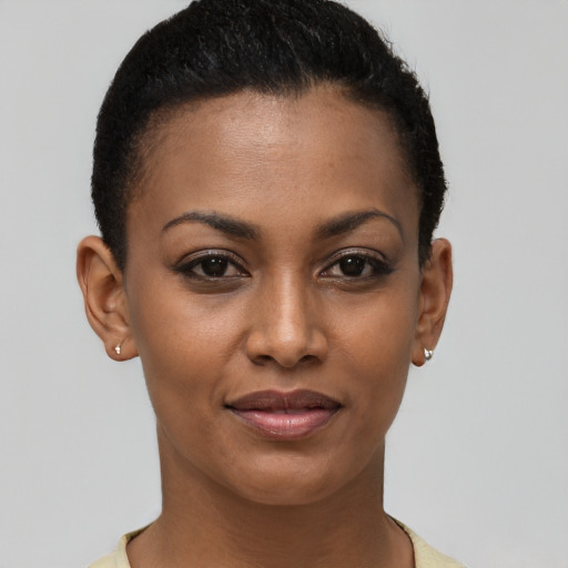 Joyful latino young-adult female with short  brown hair and brown eyes