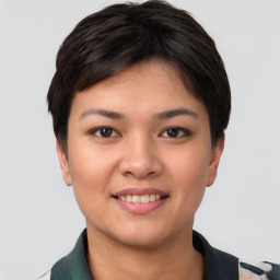 Joyful asian young-adult female with short  brown hair and brown eyes