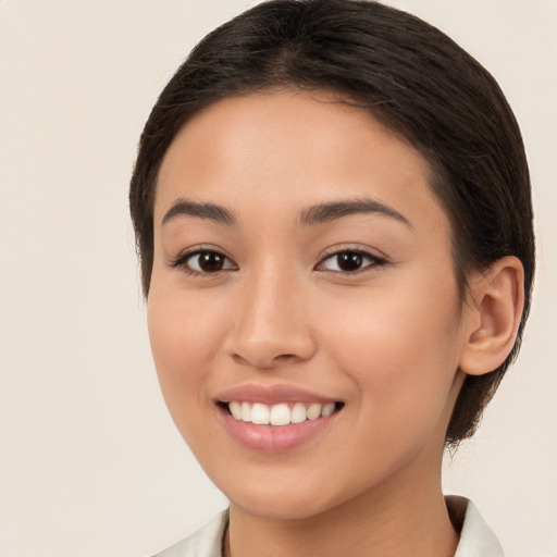 Joyful white young-adult female with long  brown hair and brown eyes