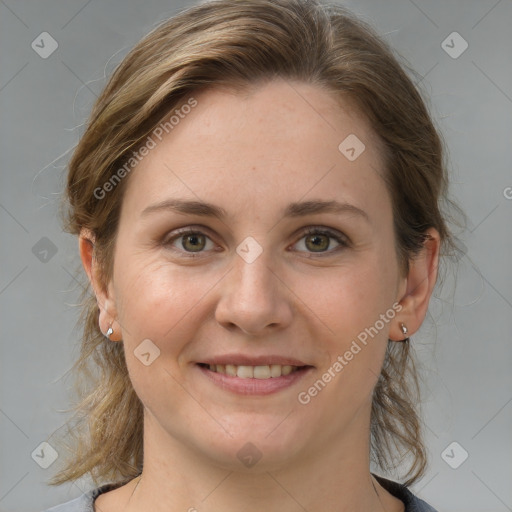 Joyful white young-adult female with medium  brown hair and grey eyes